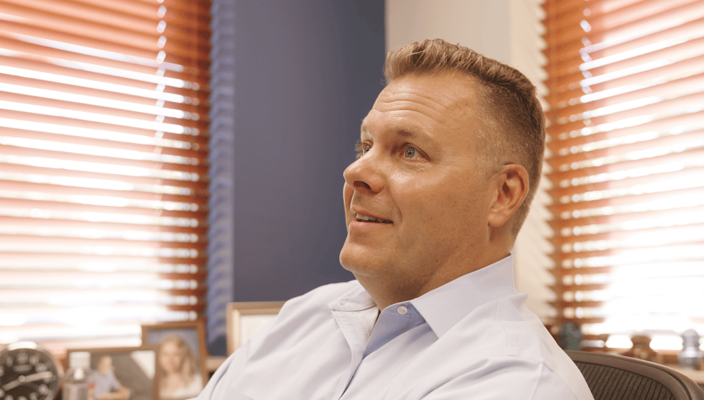 Aaron Smiling in Office Facing Left