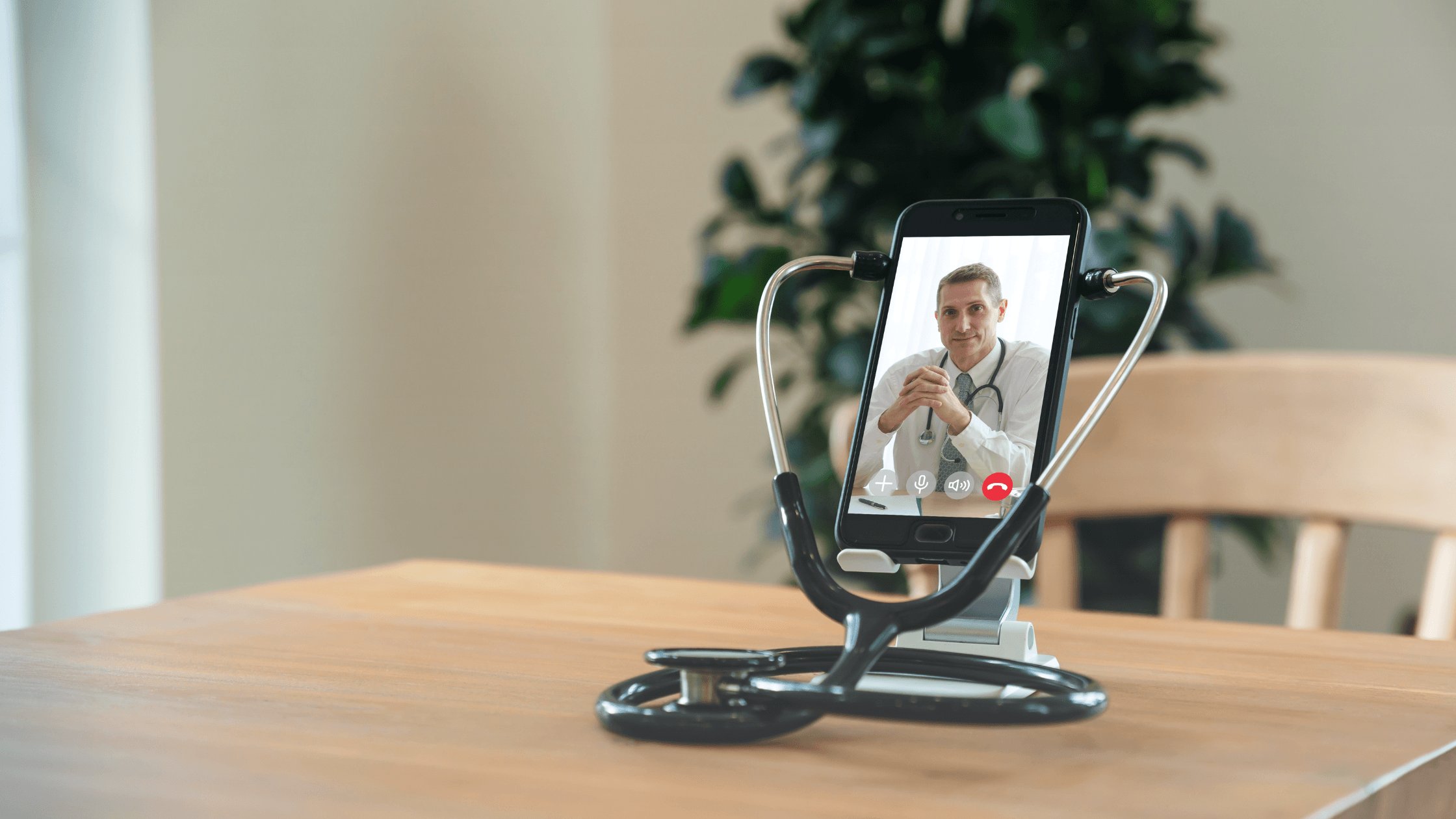 Stethoscope held up around a phone